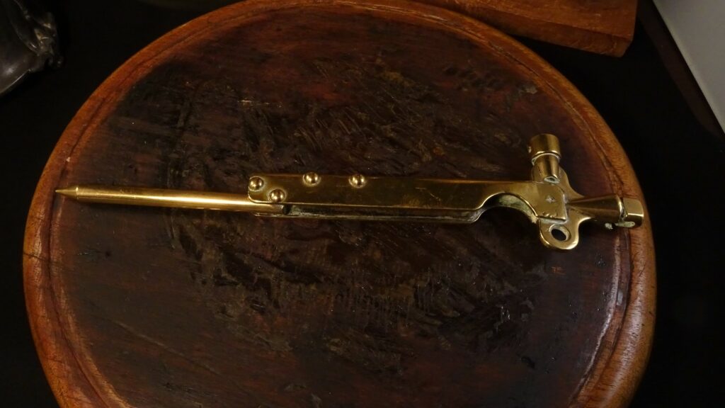 The bomb detonator with the spike fully extended.