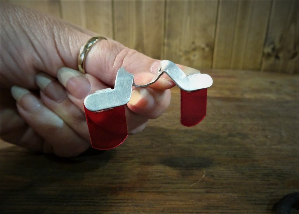 Chicken glasses being held in a hand.